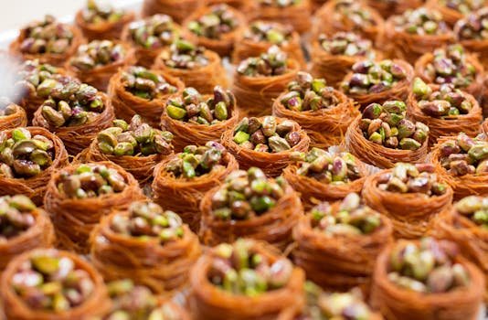 Close-up of delicious baklava nests filled with pistachios, showcasing a sweet dessert treat.